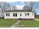 Charming single-story home with a quaint front porch and freshly cut lawn at 315 S Parkway Dr, Anderson, IN 46013
