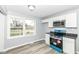 Updated kitchen featuring white cabinets, gray walls, and a modern stainless steel oven at 315 S Parkway Dr, Anderson, IN 46013