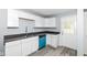 Renovated kitchen with white cabinets, gray walls, and a blue dishwasher at 315 S Parkway Dr, Anderson, IN 46013