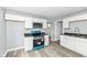 Updated kitchen featuring white cabinets, gray walls, and a modern stainless steel oven at 315 S Parkway Dr, Anderson, IN 46013