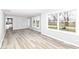 This open living space offers gray floors and abundant natural light at 315 S Parkway Dr, Anderson, IN 46013