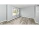 Bright living room featuring modern gray flooring and abundant natural light at 315 S Parkway Dr, Anderson, IN 46013