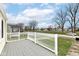 Relax on this porch with a white railing overlooking the neighborhood street at 315 S Parkway Dr, Anderson, IN 46013