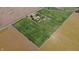 Aerial view of the home with surrounding farmland, trees, and long driveways at 3451 N County Road 100 E, Danville, IN 46122