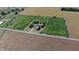 Aerial view of the home, surrounded by farms, with mature trees and long driveways at 3451 N County Road 100 E, Danville, IN 46122