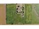 Drone's-eye view of property featuring a brick house, barn, and long driveways, with expansive farmland surroundings at 3451 N County Road 100 E, Danville, IN 46122