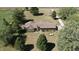 Aerial view of a brick house with lush landscaping, a large yard and long driveway at 3451 N County Road 100 E, Danville, IN 46122