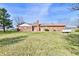 Inviting backyard highlighting the home's exterior and the expansive grassy area at 3451 N County Road 100 E, Danville, IN 46122