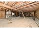 Spacious unfinished basement featuring exposed wooden beams, dirt floor and ladder access to upper level at 3451 N County Road 100 E, Danville, IN 46122