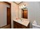 Bathroom with wallpaper, vanity, a mirror and traditional fixtures at 3451 N County Road 100 E, Danville, IN 46122
