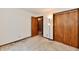 Bedroom with neutral walls, carpet, and a closet with bi-fold doors at 3451 N County Road 100 E, Danville, IN 46122