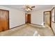 This bright bedroom features neutral walls, carpeted floors, and a view into the en-suite bathroom at 3451 N County Road 100 E, Danville, IN 46122