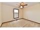 This bright bedroom features neutral walls, carpeted floors and a ceiling fan with lighting at 3451 N County Road 100 E, Danville, IN 46122