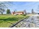 Scenic view of the driveway and backyard showcasing the home's rural charm at 3451 N County Road 100 E, Danville, IN 46122