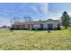 Charming one-story brick home featuring large windows and a well-manicured lawn at 3451 N County Road 100 E, Danville, IN 46122