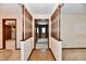 Open foyer featuring patterned tile flooring, wood railing, and neutral wall colors with decorative wallpaper details at 3451 N County Road 100 E, Danville, IN 46122