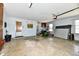 Well-lit garage offering ample space with a door, window, and wall-mounted storage units at 3451 N County Road 100 E, Danville, IN 46122