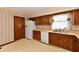 The kitchen includes wood cabinets and essential appliances, such as a dishwasher and a white refrigerator at 3451 N County Road 100 E, Danville, IN 46122