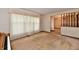 Cozy living room with plush carpeting, a large window with sheer curtains, and decorative wallpaper at 3451 N County Road 100 E, Danville, IN 46122