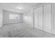 Large bedroom with neutral carpet, bright windows, and a double door closet at 3710 Orchard Ave, Indianapolis, IN 46218