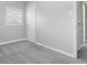 Bright bedroom with neutral carpet, white door, and a window letting in natural light at 3710 Orchard Ave, Indianapolis, IN 46218