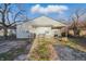 Charming single-story home with a welcoming front porch and accessible ramp at 3710 Orchard Ave, Indianapolis, IN 46218