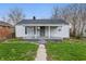Charming single-story home featuring a covered front porch and a well-maintained lawn at 3710 Orchard Ave, Indianapolis, IN 46218