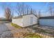 Spacious detached white garage with side yard shed, perfect for storage and projects at 3710 Orchard Ave, Indianapolis, IN 46218