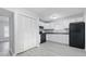 Efficient kitchen layout with white cabinets, black appliances, and a spacious feel at 3710 Orchard Ave, Indianapolis, IN 46218