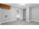 Spacious living room with hardwood flooring, wooden cabinets, and a doorway to the laundry room at 3710 Orchard Ave, Indianapolis, IN 46218