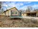 Backyard showcasing a trampoline, a single-story house with garage, and trees, ideal for outdoor enjoyment at 3940 N Drexel Ave, Indianapolis, IN 46226