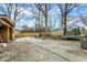 Spacious backyard features a gravel area, trampoline, and fencing, perfect for outdoor activities and privacy at 3940 N Drexel Ave, Indianapolis, IN 46226