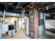 Unfinished basement showing the essential utilities and ample space for storage and/or finishing at 3940 N Drexel Ave, Indianapolis, IN 46226