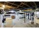 Unfinished basement with utilities, exposed ductwork and ceiling joists, offering potential for customization at 3940 N Drexel Ave, Indianapolis, IN 46226
