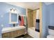 Bathroom features updated vanity and a shower and bath combo at 3940 N Drexel Ave, Indianapolis, IN 46226