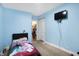 Charming bedroom with a single bed, a TV, and an adjacent closet, ideal for a or guest at 3940 N Drexel Ave, Indianapolis, IN 46226