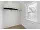 Empty closet featuring a shelf and a window for natural light, offering potential for customization at 3940 N Drexel Ave, Indianapolis, IN 46226