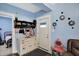 Bright entryway showcasing a charming accent cabinet, coat rack and a view into the adjacent bedroom at 3940 N Drexel Ave, Indianapolis, IN 46226