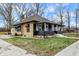 Bungalow-style home with a porch supported by columns and a quaint front yard near a city street at 3940 N Drexel Ave, Indianapolis, IN 46226