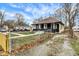 Classic bungalow-style home featuring a fenced yard, mature trees, and ample parking in a residential neighborhood at 3940 N Drexel Ave, Indianapolis, IN 46226