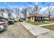 Charming single-story home with a well-maintained yard, extended driveway, and detached garage, perfect for comfortable living at 3940 N Drexel Ave, Indianapolis, IN 46226