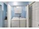 Laundry room features a washer, dryer and storage cabinets at 3940 N Drexel Ave, Indianapolis, IN 46226