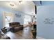 Cozy living room with light blue walls, plush leather seating, and natural light creating an inviting space at 3940 N Drexel Ave, Indianapolis, IN 46226
