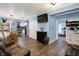Bright and airy living space featuring a comfortable seating area, dining area, and partial view of a modern kitchen at 3940 N Drexel Ave, Indianapolis, IN 46226