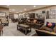 Finished basement with comfortable seating, a decorative coffee table and ample wall decor at 4030 Statesmen Dr, Indianapolis, IN 46250