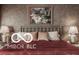 This primary bedroom is complete with hardwood floors and a large window at 4030 Statesmen Dr, Indianapolis, IN 46250