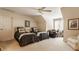 Cozy bedroom featuring two beds, a ceiling fan, and a bright desk area near the window at 4030 Statesmen Dr, Indianapolis, IN 46250