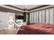 This primary bedroom is complete with hardwood floors and a large window at 4030 Statesmen Dr, Indianapolis, IN 46250