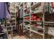 Walk-in closet with custom shelving, providing ample storage space for clothes and accessories at 4030 Statesmen Dr, Indianapolis, IN 46250