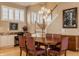 Inviting dining area with stairway access, featuring a warm aesthetic, perfect for Gathering gatherings at 4030 Statesmen Dr, Indianapolis, IN 46250